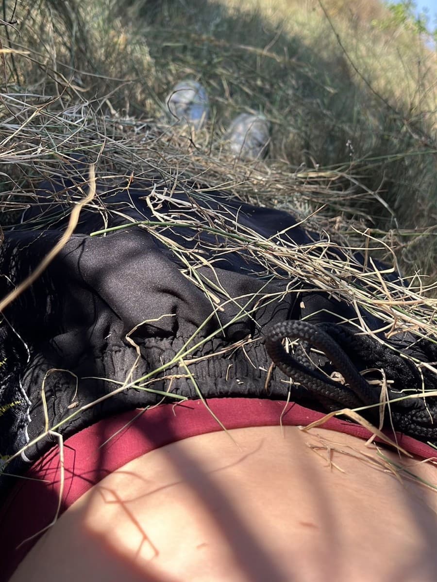 A woman hiding in a bush