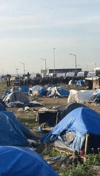 Exclusive videos show French police clear hundreds from migrant camp with ‘tear gas’  